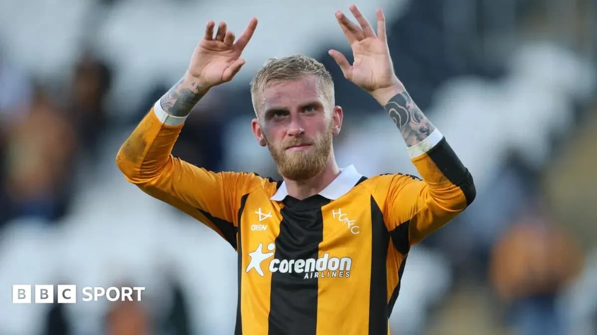 Player celebrating with hands raised after match