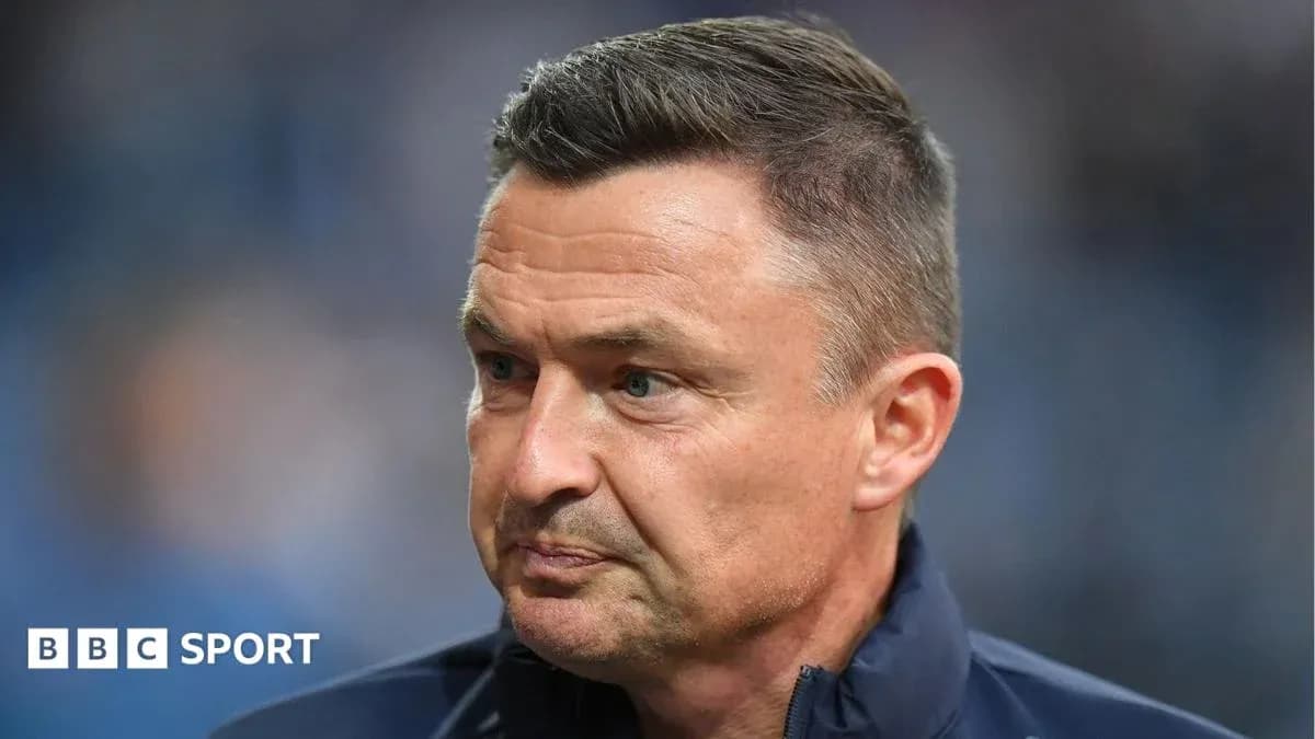 Coach focused during a match or press conference