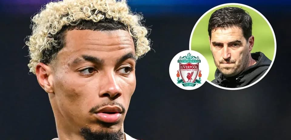 Player with curly hair next to Liverpool logo
