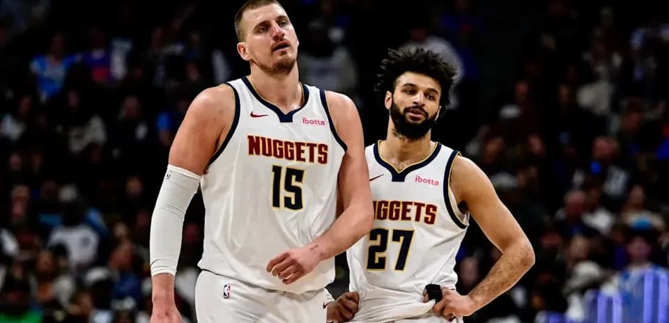 Nikola Jokić and Jamal Murray walking off court