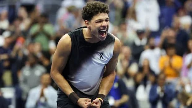 Player celebrating victory at tennis match