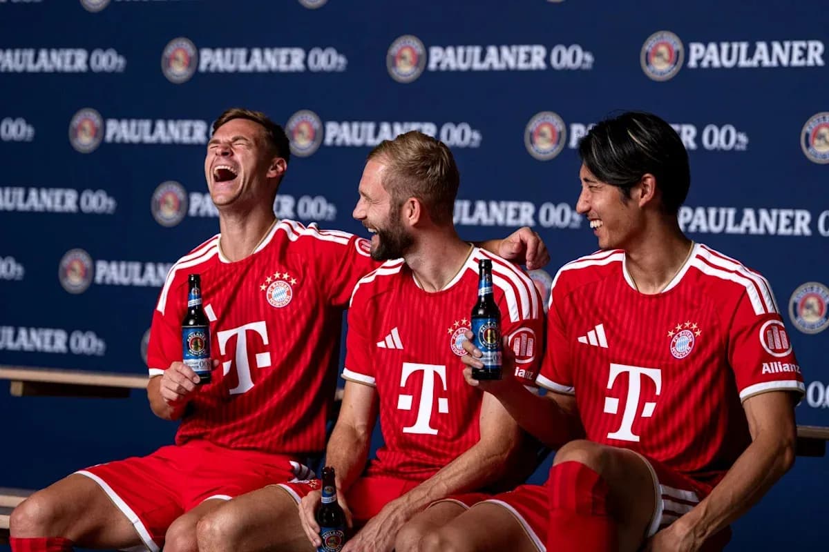 Three Bayern Munich players posing with drinks