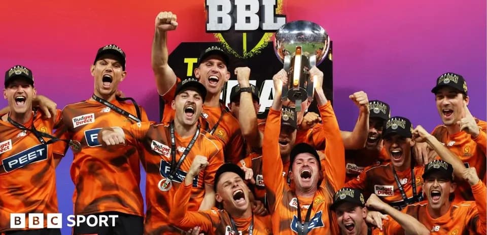 Team celebrating with trophy after BBL victory