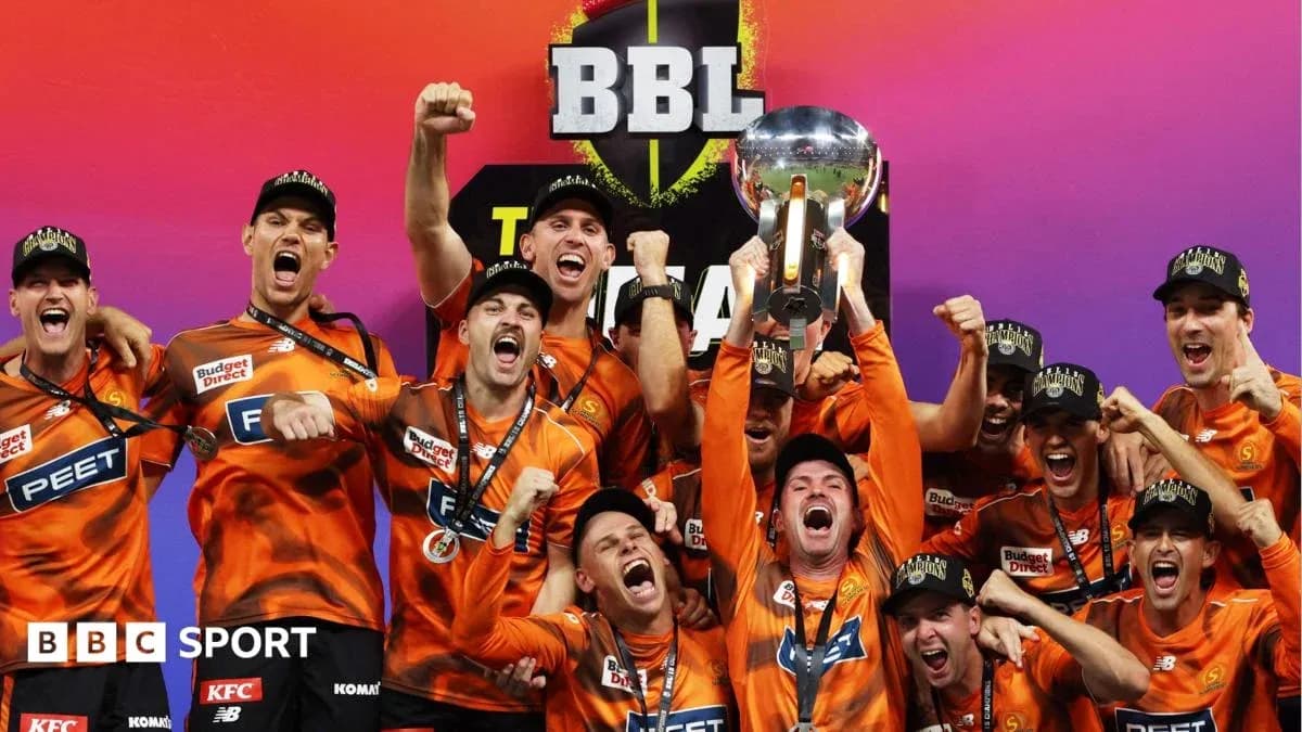 Team celebrating with trophy after BBL victory