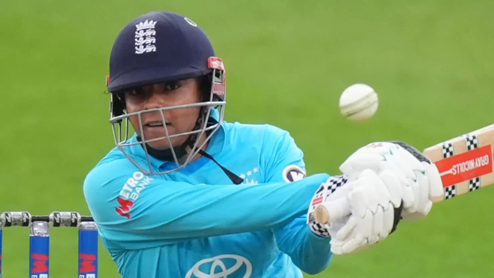 Batter playing a shot during cricket match