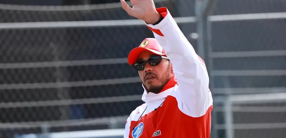 Driver waving during a motorsport event