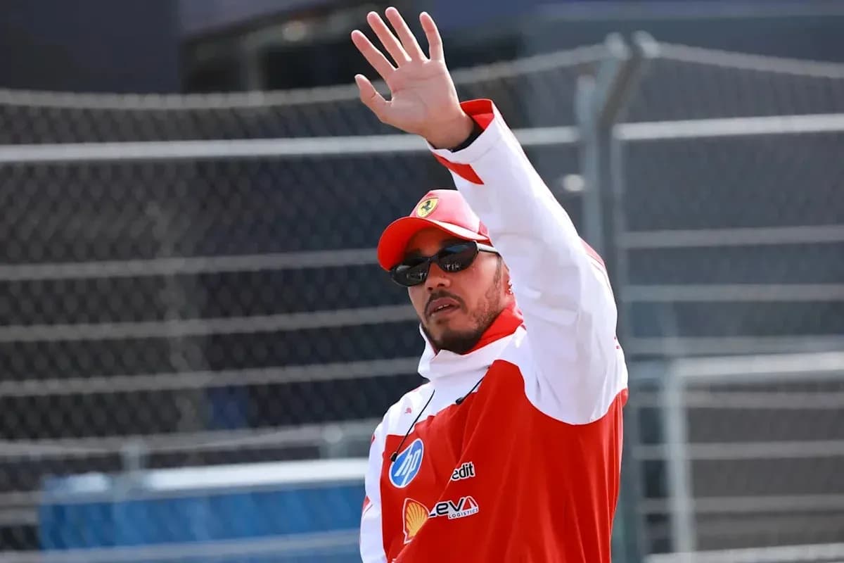 Driver waving during a motorsport event