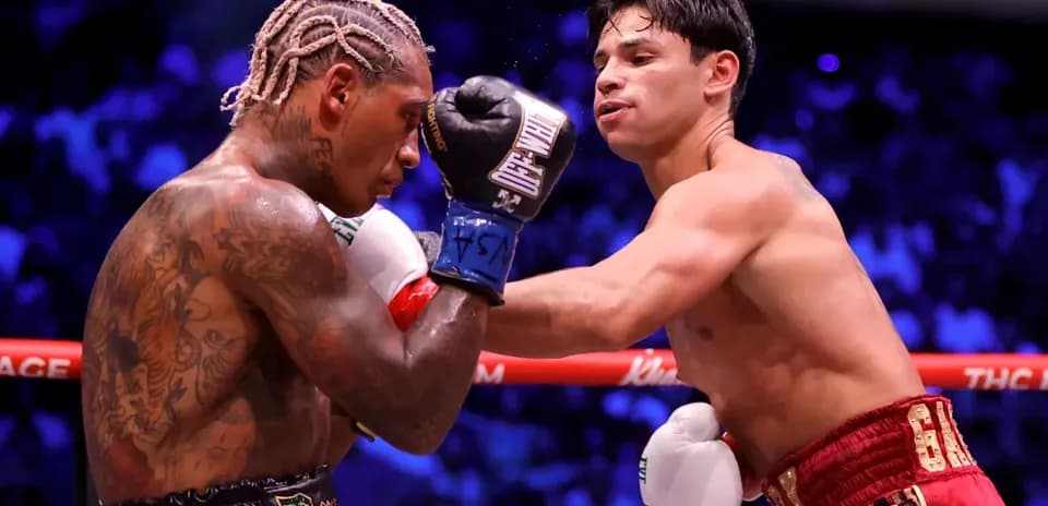 Two boxers exchanging punches in the ring