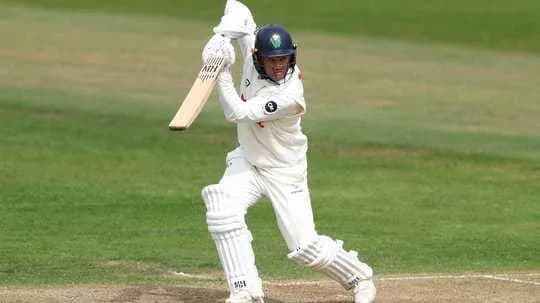 Batsman preparing to hit the ball on pitch