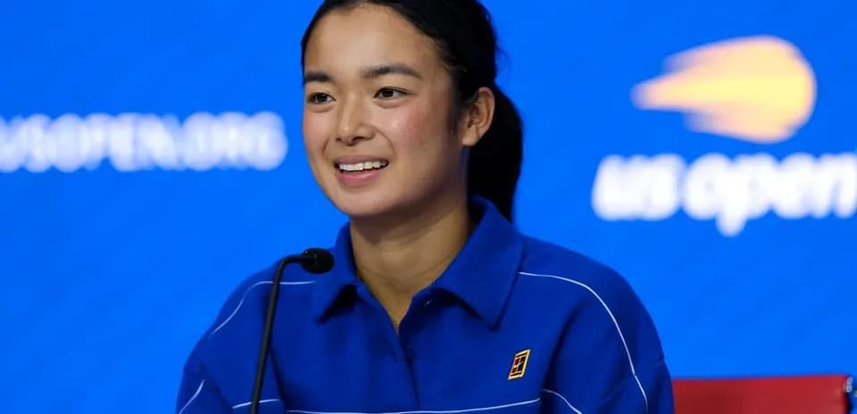 Player at press conference with blue background
