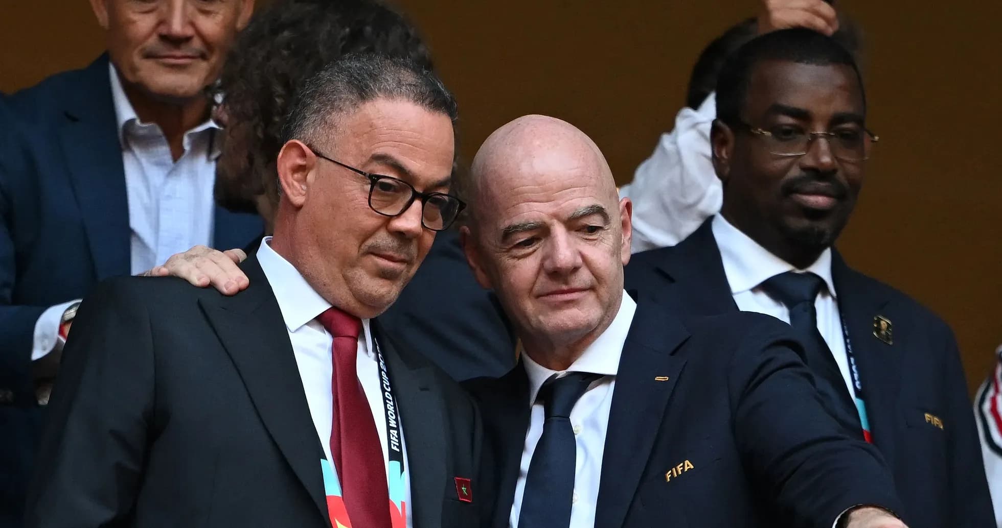 Two officials discussing at a sporting event