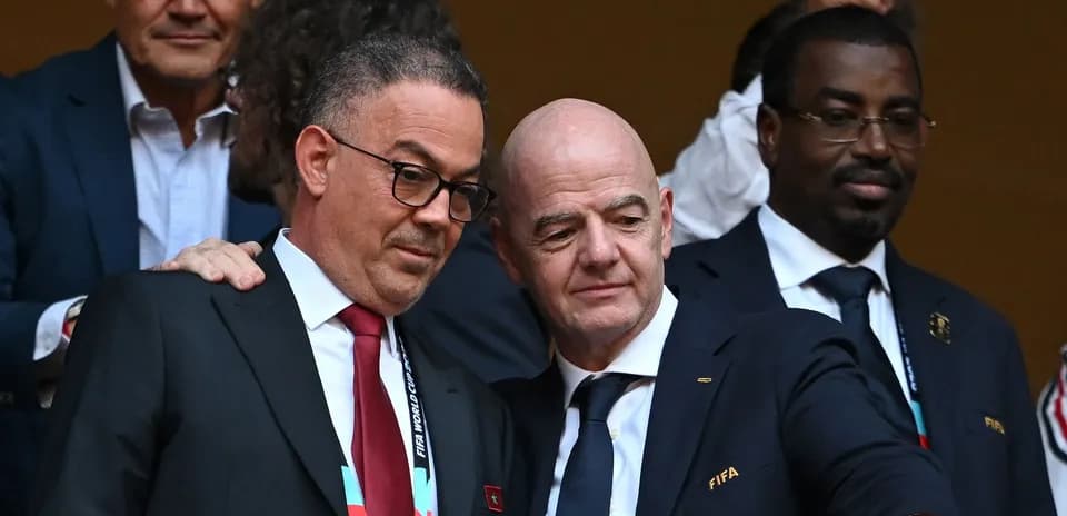 Two officials discussing at a sporting event