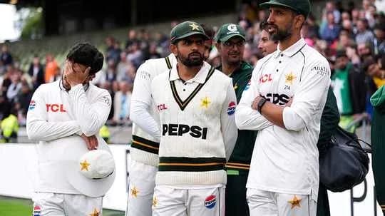 Pakistani cricket team members in team uniforms