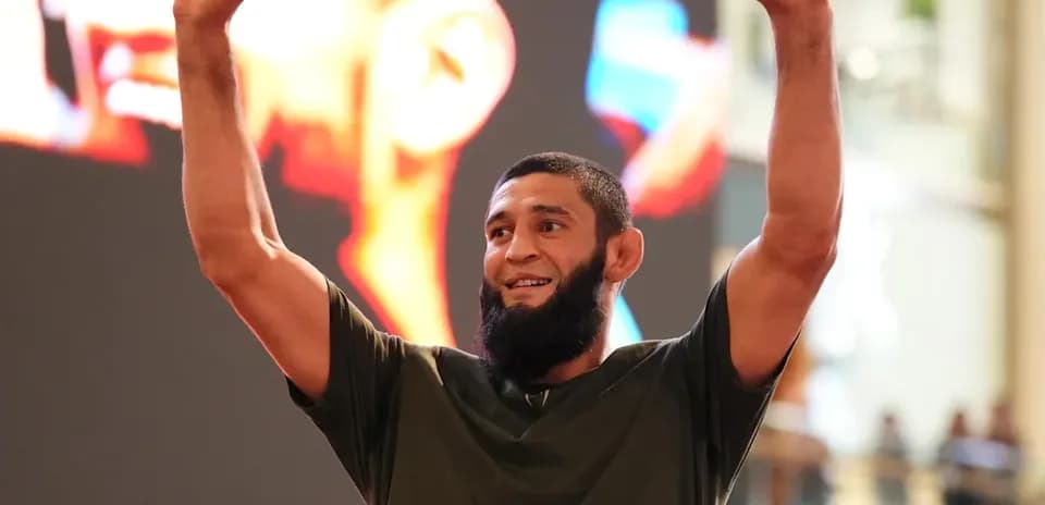 Athlete celebrating with raised arms at event