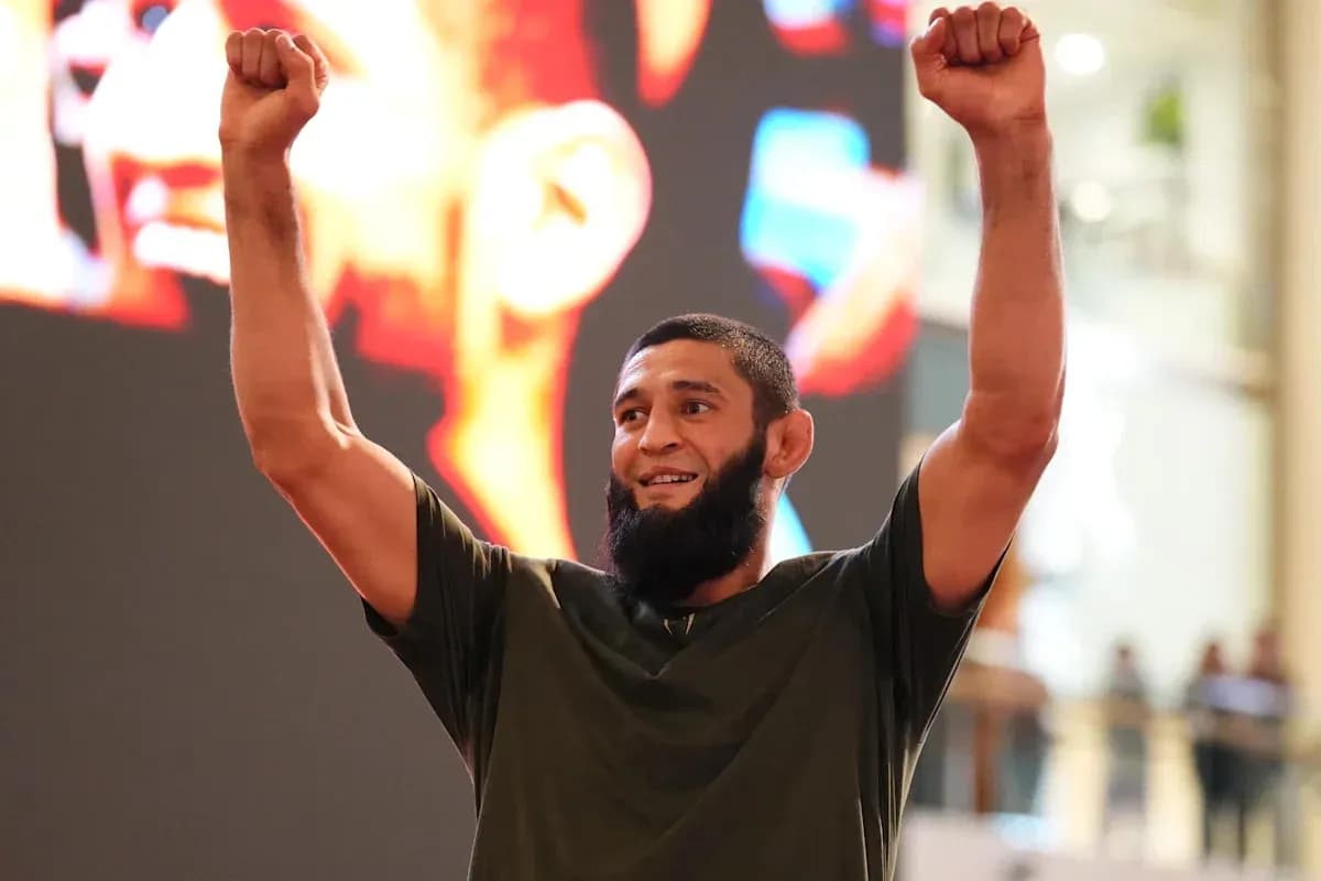 Athlete celebrating with raised arms at event