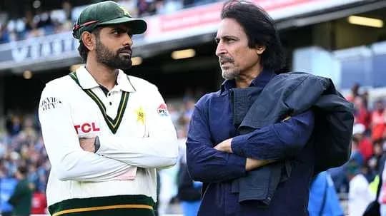Cricketer and official discussing on the field
