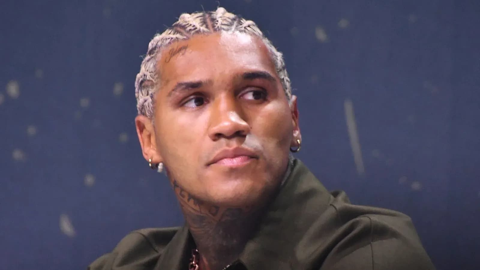 Athlete with braided hair during press event