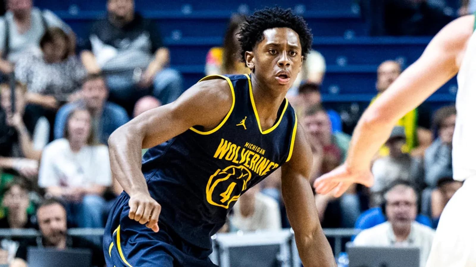 Player in Michigan Wolverines jersey during game