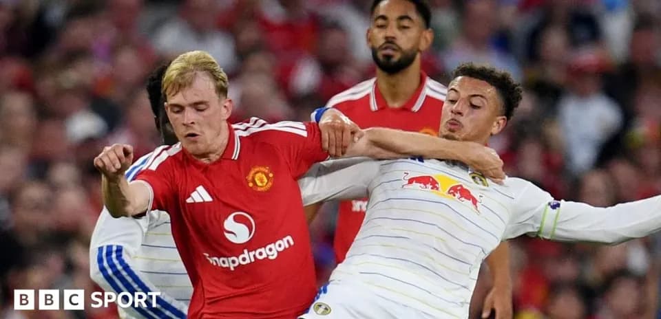 Two players contesting the ball during football match