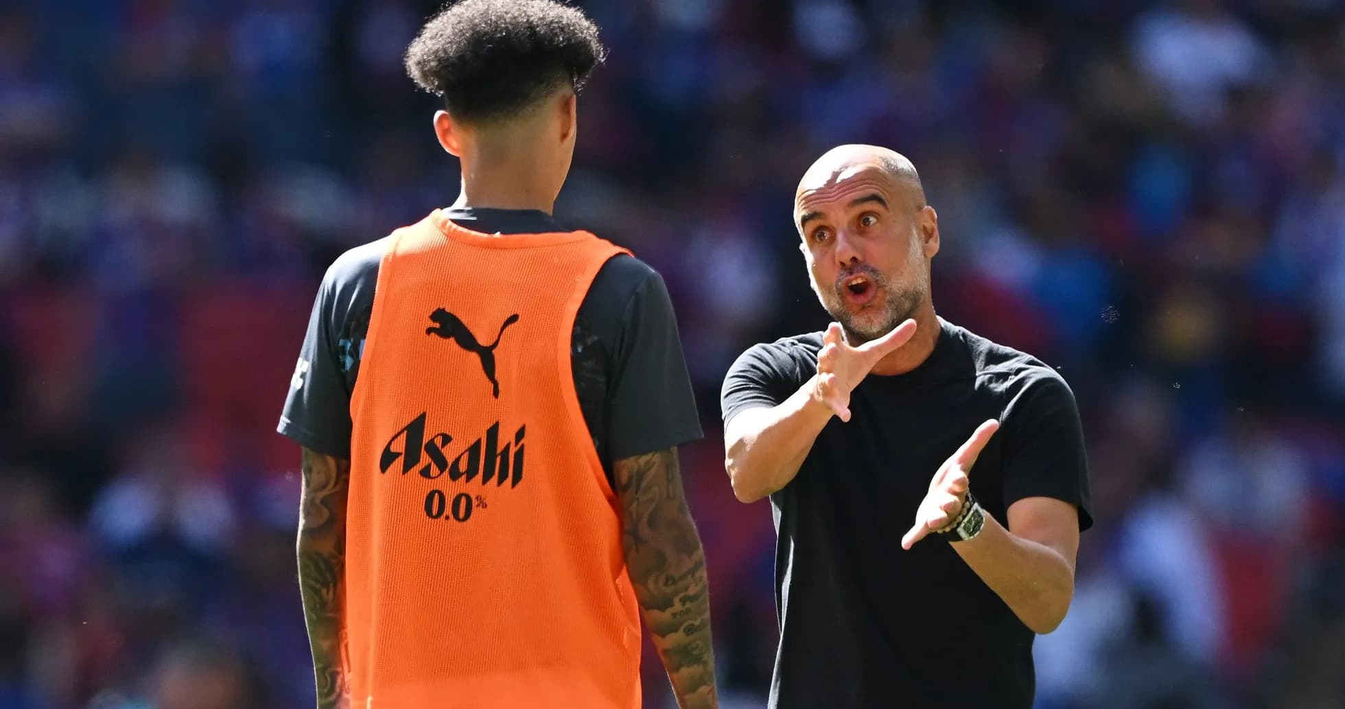 Coach giving instructions to player during training