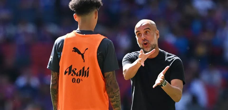 Coach giving instructions to player during training