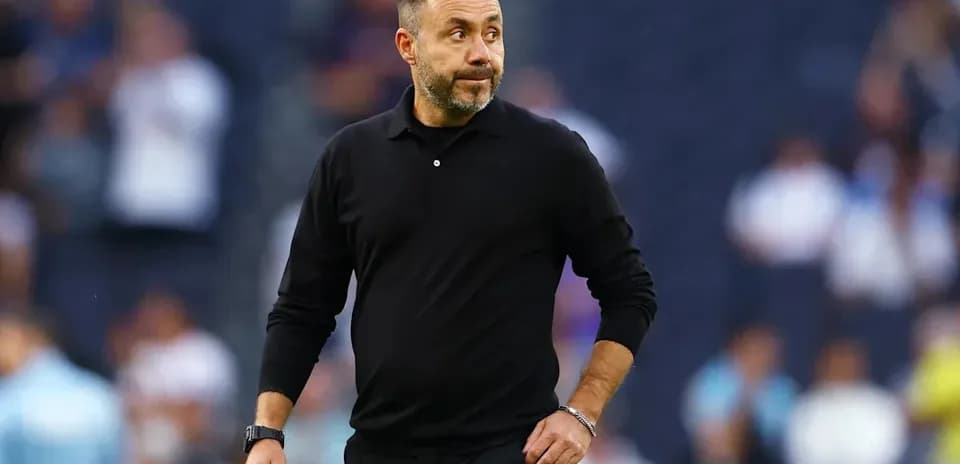 Coach walking on the sidelines during a match