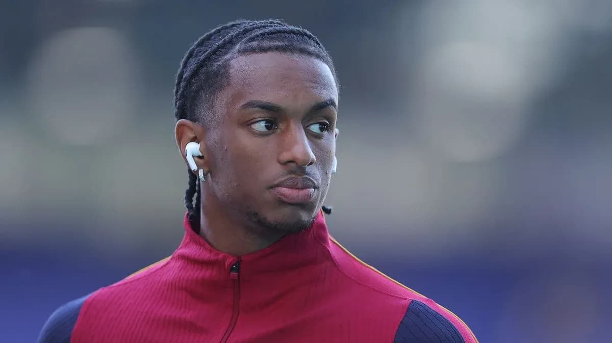 Player wearing earbuds during warm-up before match
