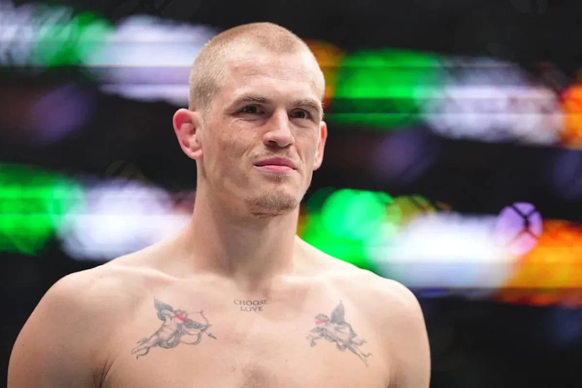 Fighter with tattoos standing in the ring