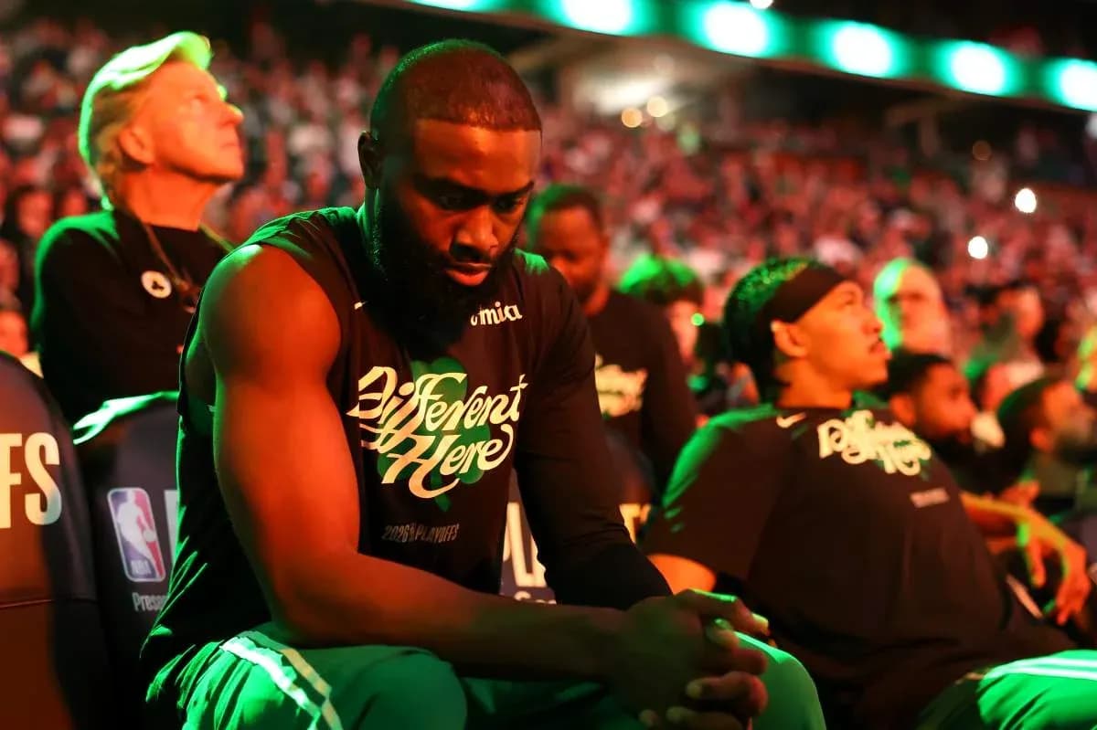 Players seated on bench during playoff game atmosphere