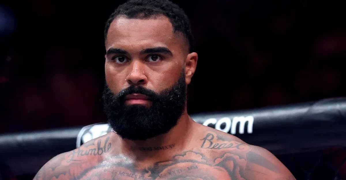 Fighter with tattoos and beard in the ring