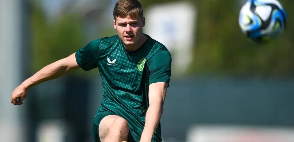 Player striking a soccer ball during training session