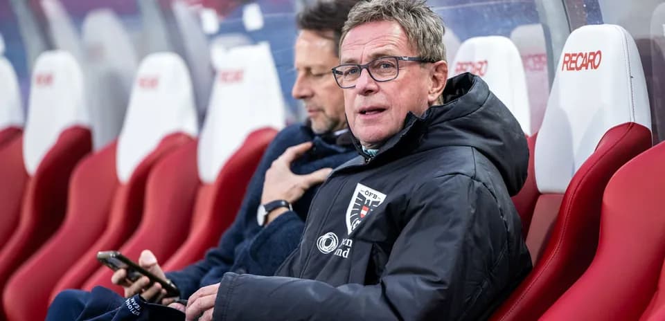 Coaches seated on the bench during a match