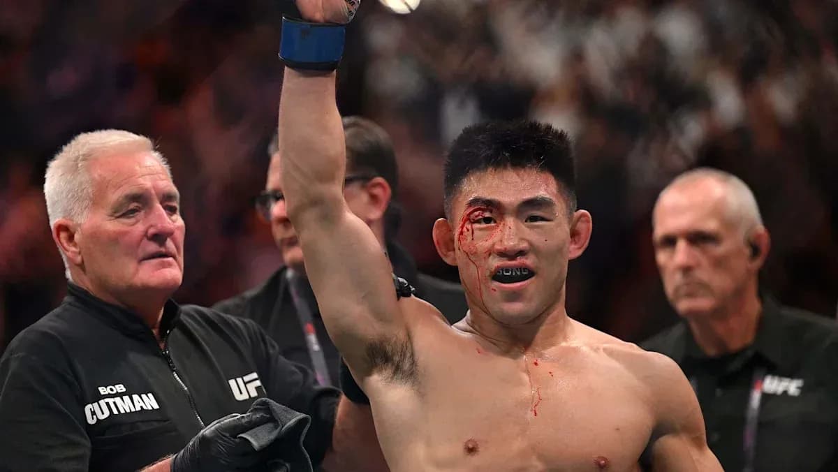 Fighter celebrating victory with a bloody face