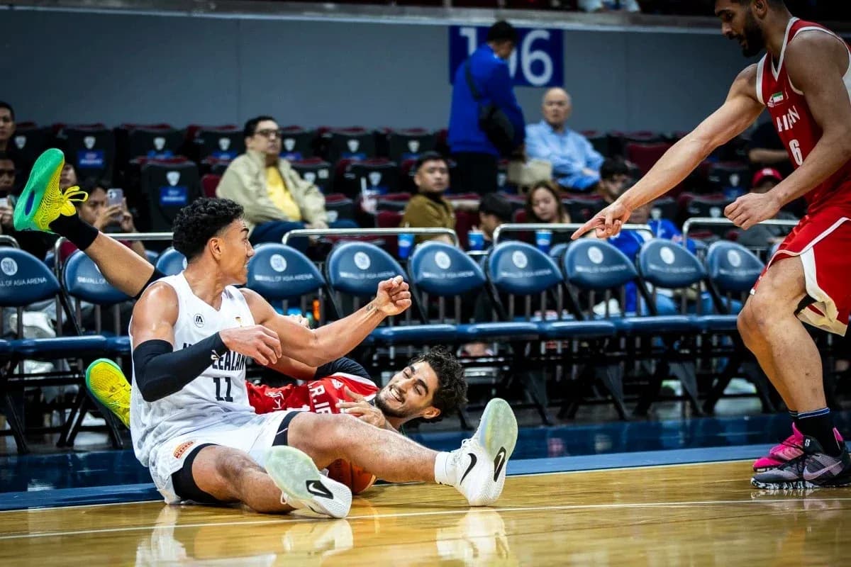 Two players on the floor after a play