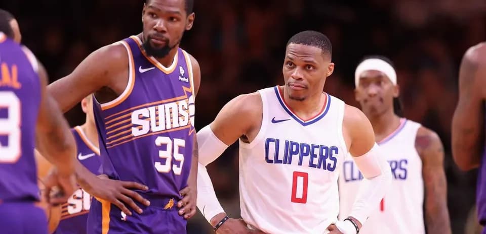 Kevin Durant and Russell Westbrook on court during game