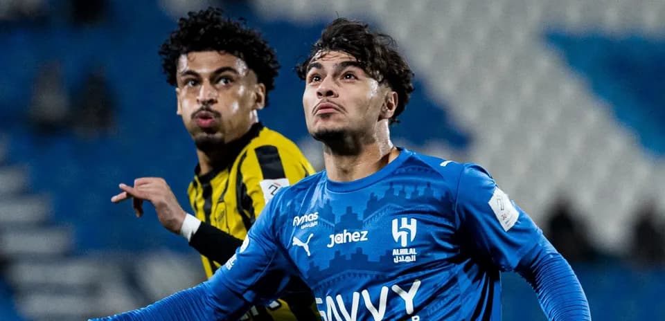 Two football players competing during a match