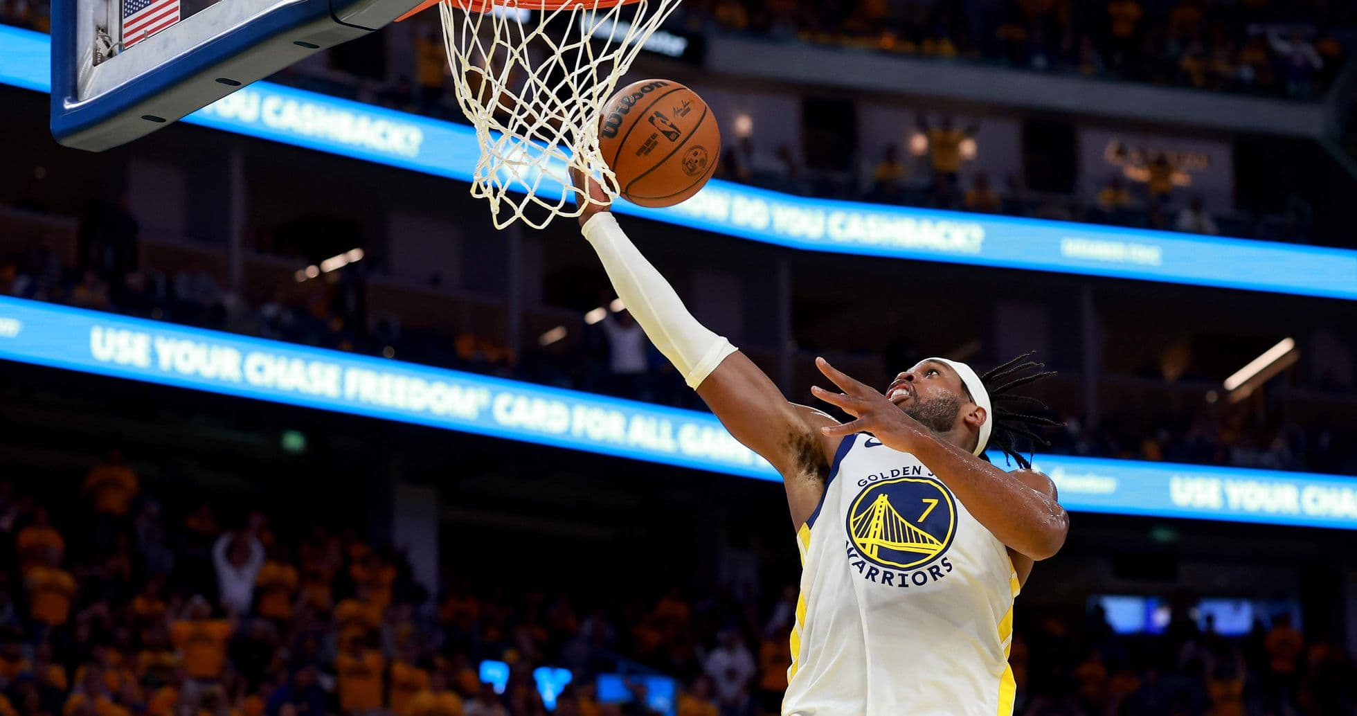 Player scoring a layup during basketball game