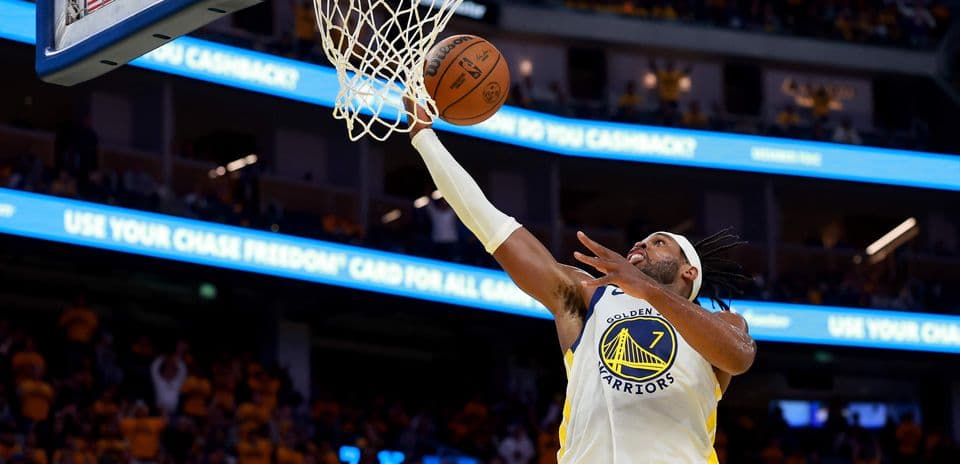 Player scoring a layup during basketball game