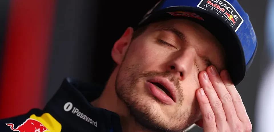 Driver resting during press conference with closed eyes