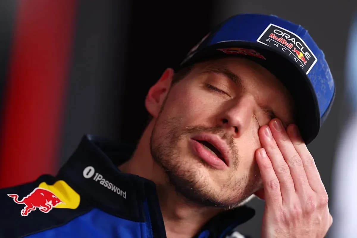 Driver resting during press conference with closed eyes