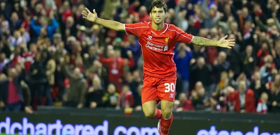 Player celebrating goal at Anfield stadium