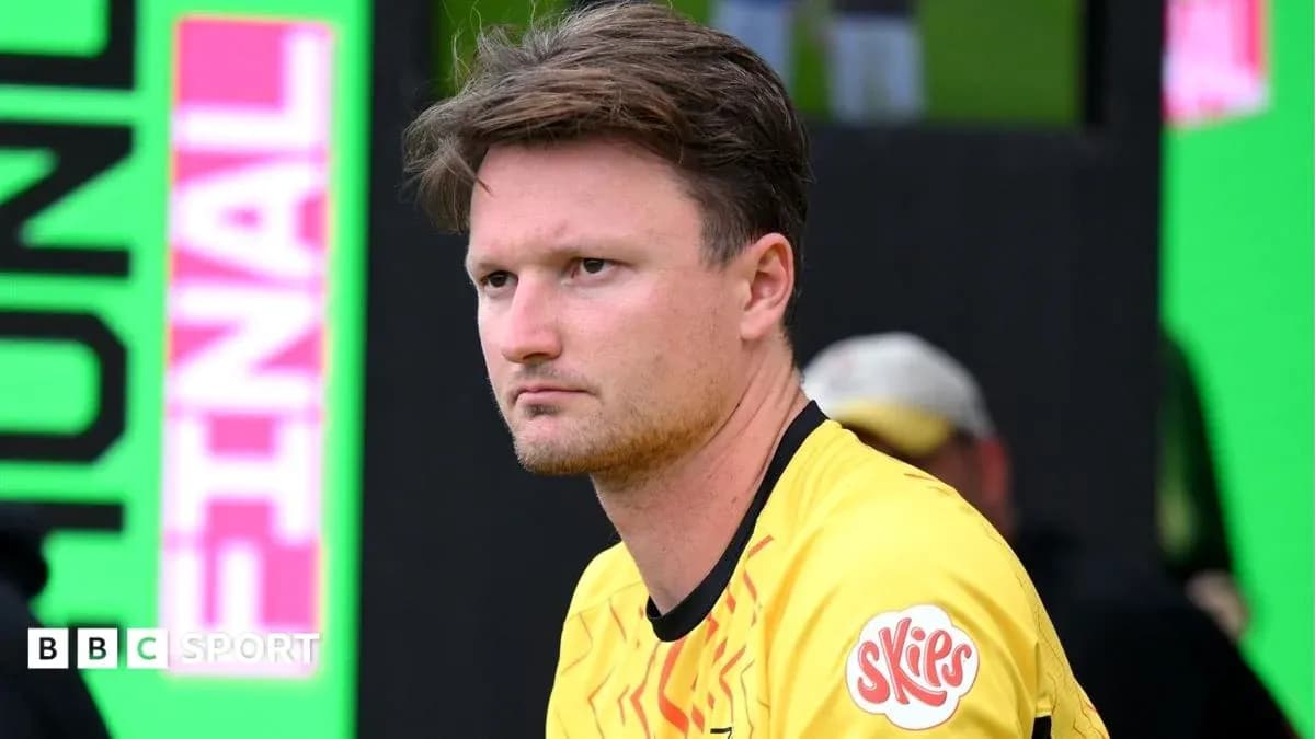 Goalkeeper in yellow jersey sitting on bench