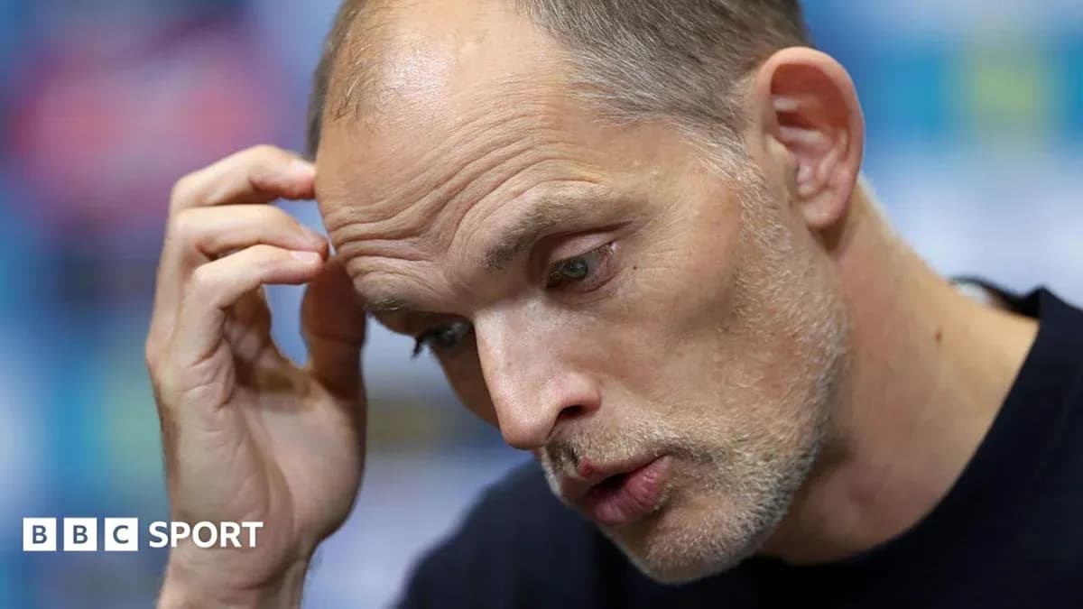 Coach speaking during a press conference