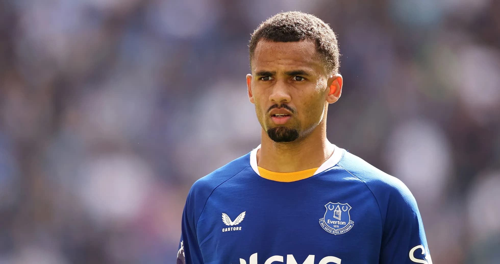 Player wearing Everton jersey on the pitch