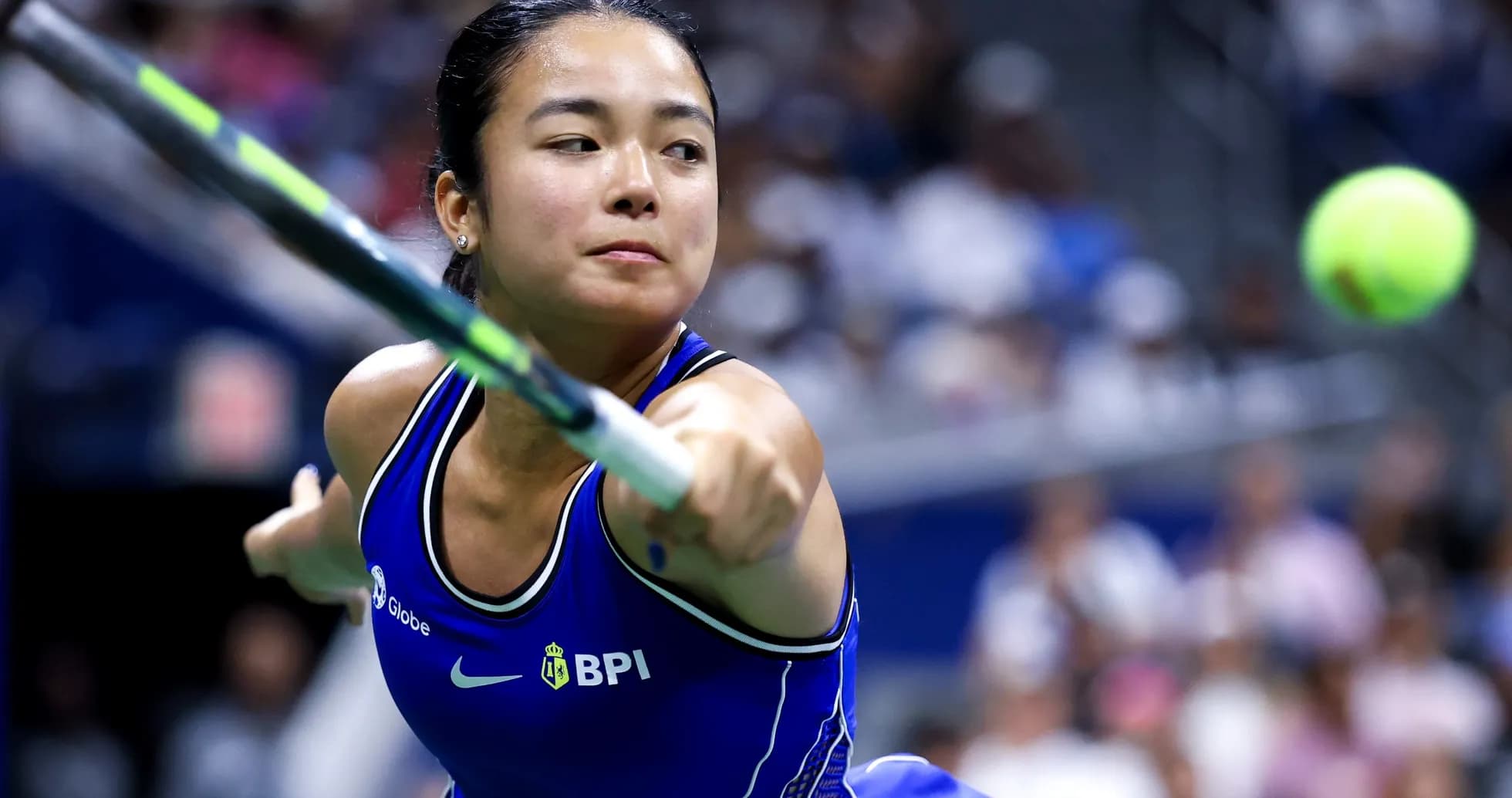 Player hitting a tennis ball during match