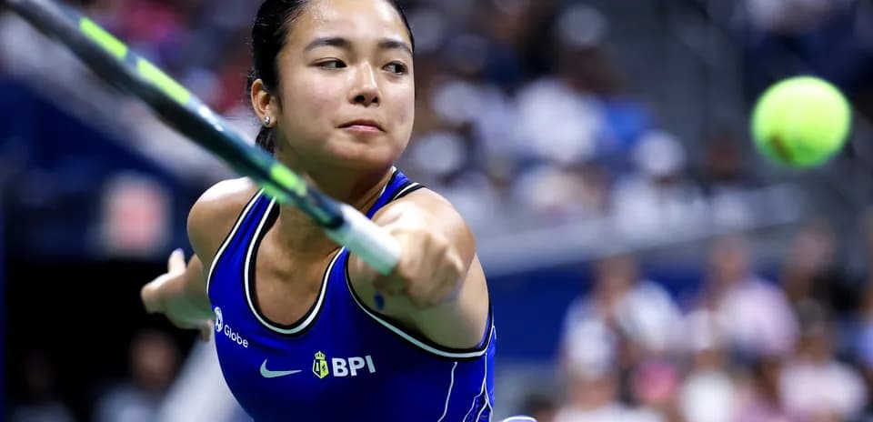 Player hitting a tennis ball during match