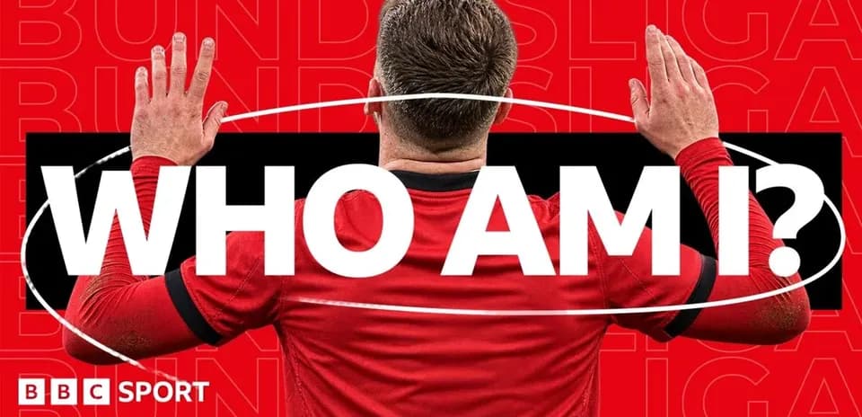 Player in red jersey with hands raised in question