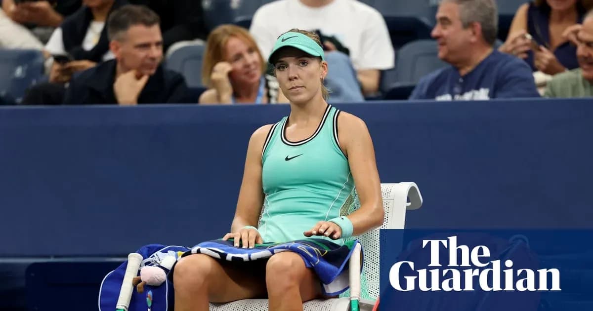 Tennis player seated on bench during match break