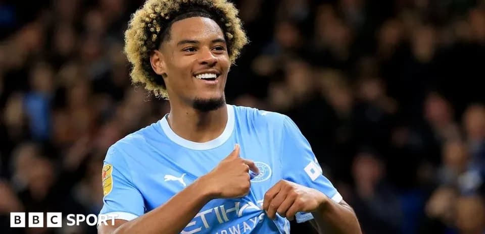 Player celebrating in Manchester City kit