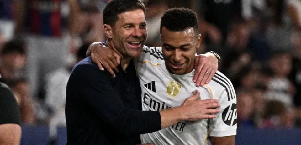 Coach and player celebrating on the field